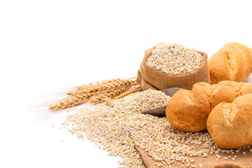 Delicious organic bread with wheat ears and wheat grains There is space to copy text. On a white table top in a rustic kitchen - top view