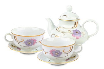 Vintage porcelain teapot and tea cups with saucers isolated on white