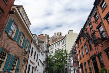 Fototapeta na wymiar Street with Old and Colorful Homes and Residential Buildings in Greenwich Village of New York City