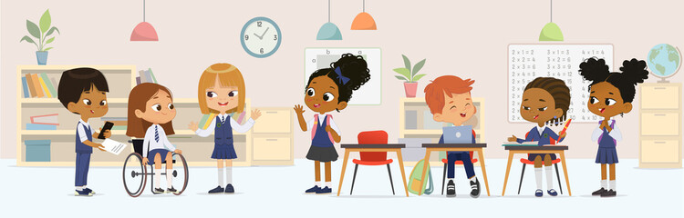 Cheerful diverse kids in school uniform talking sitting at tables enjoying lesson inclusion education vector banner. Little girl in wheelchair greeting to schoolboy and schoolgirl classmates isolated - 458068134