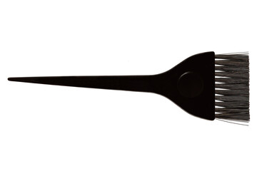 Black brush for dyeing hair. Professional care in the salon. Isolated on white background. Close-up.