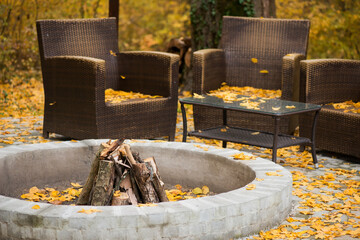 Cozy Autumn patio with chairs, hearth and firewoods.Exterior in backyard for relax in autumn...