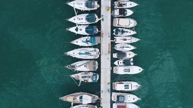 Boats are moored at the marina. Luxurious boats and yachts moored in a beautiful harbor. European Mediterranean.