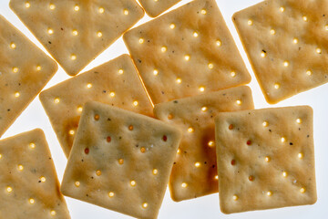 stack of square crackers in backlight isolated on white background