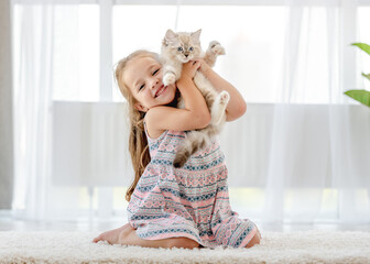 Girl with ragdoll kitten