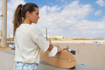 portrait beautiful skater girl looking towards infinity thoughtfully © Jose Prieto