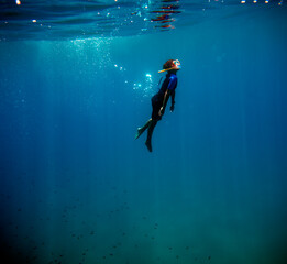 scuba diver in the blue sea