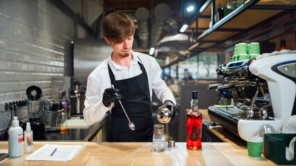 The bartender prepares a cocktail. Work in the kitchen of public catering