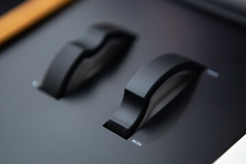 Volume regulators on musical instrument in sound recording studio. Professional audio equipment for...