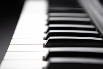 Black and white piano keys. Synthesizer keyboard in close up. Professional musical instrument for pianist