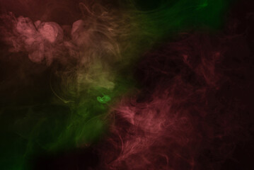 Yellow and pink steam on a black background.