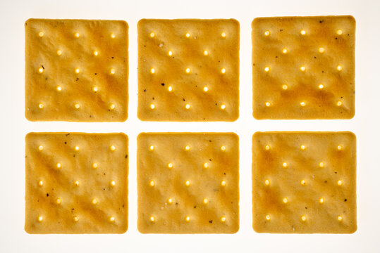 Square craker isolated on white, six cookies arranged geometrically in top view