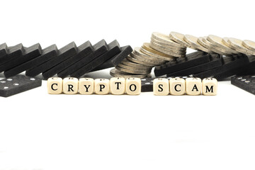 Crypto or cryptocurrency scam concept with coins and letter cubes on white background