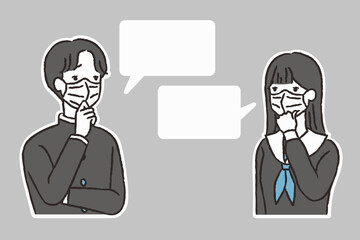 マスクで問題を話し合う男子学生と女子学生