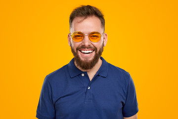 Happy bearded man in sunglasses