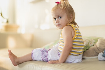 Fototapeta premium Baby plays at home