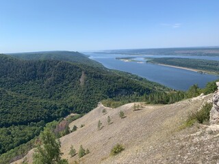 Fototapeta na wymiar View of the Zhigulevsky mountains (covered with forest) and the Volga river from the Strelna mountain