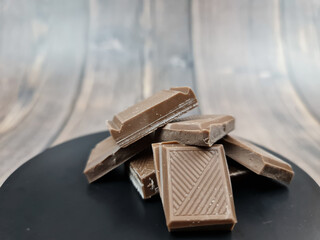 The Chocolate close-up. Pieces of natural chocolate. Milk chocolate.