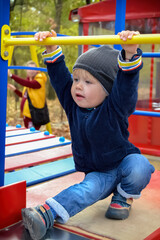 Fototapeta premium little child playing on playground