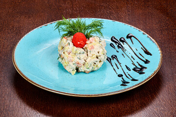 Russian salad with sausages and potato