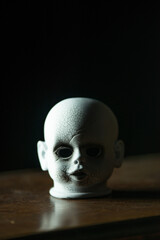 Creepy head of a hunted doll