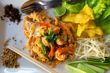 Pad thai. Padthai is a very famous Thai food & popular among the foreigner tourists. Ingredients including fresh prawns, eggs, beansprouts & tofu.