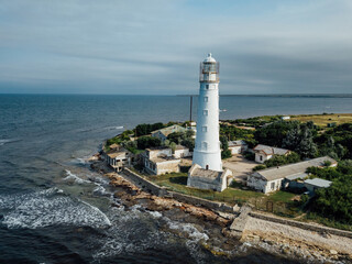 Fototapeta na wymiar Lighthouse on the sea coast, aerial drone view