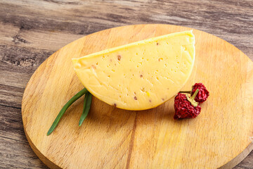 Hard cheese brick with walnut