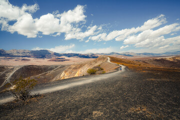 Fototapeta na wymiar Desert hiking, Death Valley National Park. Amazing volcanic landscape, Ubehebe Crater view point.