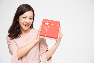 Happy beautiful Asian woman smile with gift box isolated on white background. Teenage girls in...