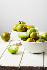 Green zebra tomatoes in a bowl.