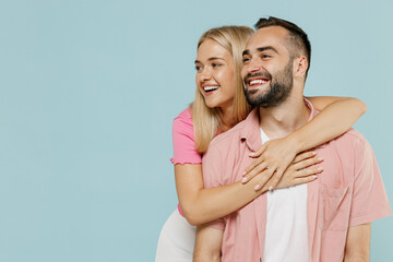 Young smiling couple two friends family man woman in casual clothes looking aside on workspace copy...