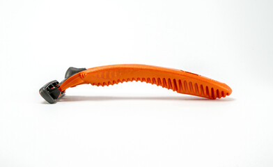 Disposable razor shaver on white background. Plastic bladed shaving tool.
