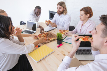 Diverse colleagues at lunch break in office