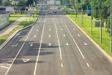 Arrow signs as road markings on a street with five lanes. Dedicated lane for public transport,...