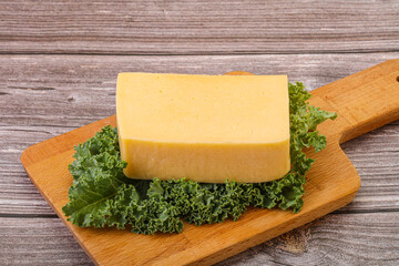 Tasty yelloow Tilsiter cheese brick