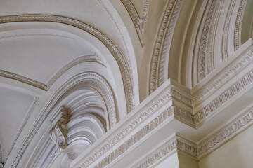 Oppulent stucco ceiling architecture with domes, archways, column, frescos and murals inside old...
