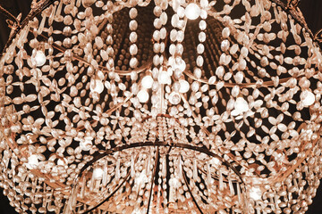 Lead crystal chandelier detail close up view inside luxury estate home house museum palace with...