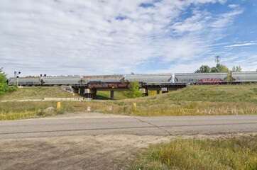 Fototapeta premium Train Cars on a Bridge