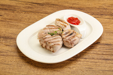 Grilled pork tenderlion with tomato sauce