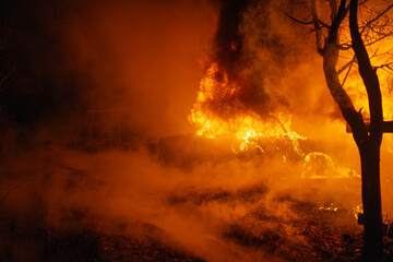 Burning car accident at night