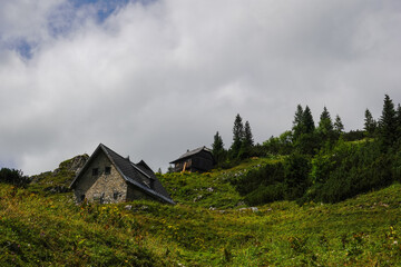Fototapeta na wymiar two alpine hut made of stones while hiking in austria