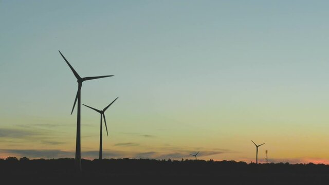 wind turbine at sunset  Niagara Region Wind Farm 230 MW of electricity