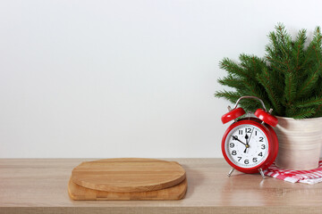 new Year's holiday background with an empty countertop an alarm clock