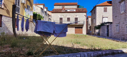 Fototapeta na wymiar View of the dryer. Stone houses in the historic center. Historic City of Trogir. Dalmatia. Croatia. Europe