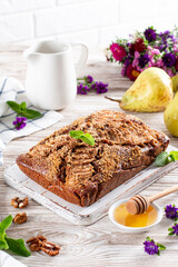 Homemade chocolate cake with pears on table