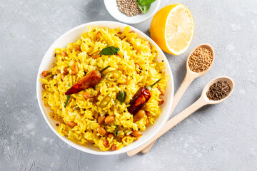 Lemon rice is one of the most easy, simple and popular south Indian rice dish in a bowl. Top view...