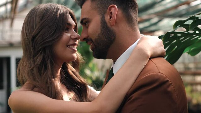 Footage of bride and groom enjoying together smiling and embracing.