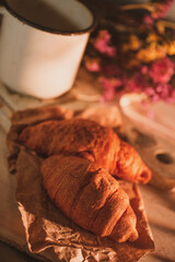 Provence still life with French croissants, rustic watering can and lavender flowers