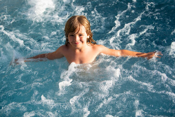 Child swimming. Kids summer vacation in swimming pool.